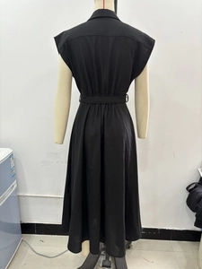 Detail of black sleeveless linen midi dress with belt and pleated back design