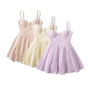 Detailed view of women's camisole lace trim dresses in pink, yellow and purple