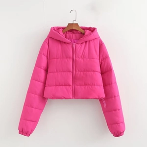 Close-up of bright pink hooded puffer jacket with quilted texture and drawstring hem