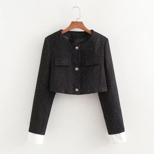 Veste en tweed noir pour femme avec sequins argentés, boutons en métal et poignets blancs