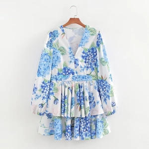 Detail of V-neck floral mini dress with blue hydrangea print and ruffled layers