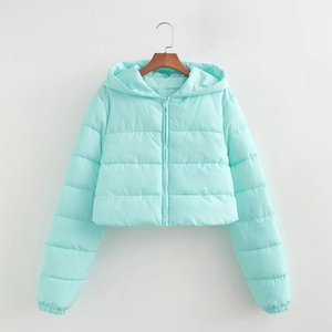 Detail of mint green hooded padded jacket featuring quilted texture and zipper closure
