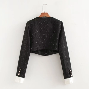 Veste courte noire à paillettes pour femme avec poignets blancs et boutons dorés, dos