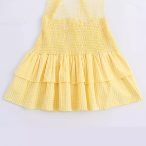Summer yellow gingham V-neck dress with smocking details and tiered ruffle hem