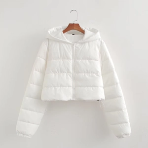 Detail view of white puffer jacket with horizontal quilting and adjustable drawstring hem