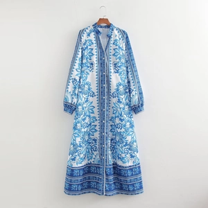 Detailed view of bohemian blue and white floral print maxi dress with button-up front