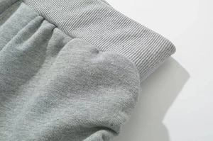 Detail of wide ribbed elastic waistband on grey cotton knit casual shorts