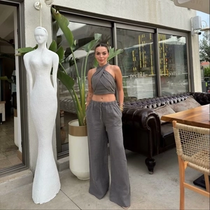 Women's dark gray linen halter crop top and high-waist wide-leg trousers casual set