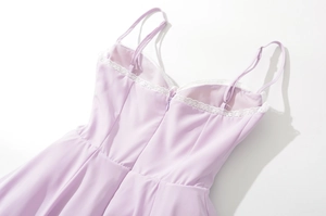 Detail of lavender dress bodice with white lace trim and hidden back zipper