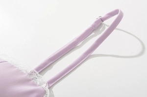 Detailed view of lavender lace dress with adjustable straps and delicate trim