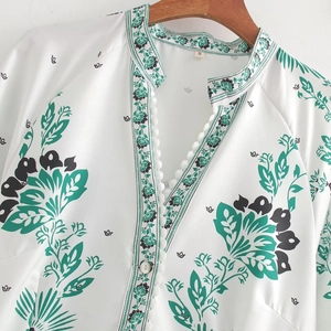 Women's V-neck printed dress with white lace trim and green bohemian floral patterns