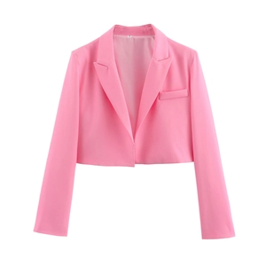 Detail of pink cropped blazer featuring a classic lapel and structured shoulder design