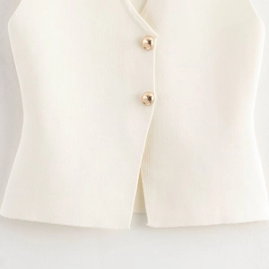 Chic white knitted sleeveless vest top with gold spherical buttons and V-neck design