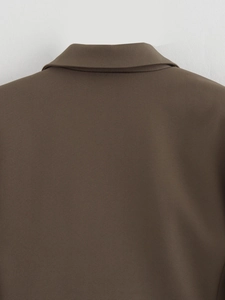 Detail view of the brown twill blazer back neckline and high-quality stitching texture
