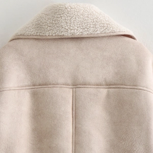 Back view of beige faux suede jacket featuring a thick white faux shearling collar