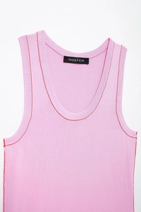 Detail of pink knit tank top featuring red contrast stitching and delicate rib texture
