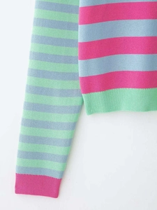 Detail showing colorful pink and blue striped knit fabric with ribbed cuffs and hem