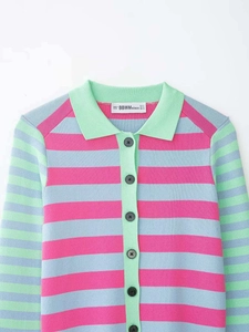 Detail of multi-color striped knit cardigan showing the polo collar and brand neck label