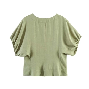 Minimalistische hellgrüne Bluse mit Puffärmeln, Rundhalsausschnitt und Texturstoff