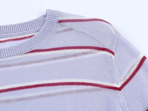 Detail of round neckline and knit texture on purple red striped summer sweater