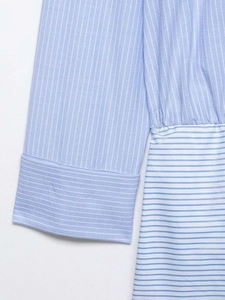 Detail of blue and white striped fabric texture and stitching of the fashion summer dress