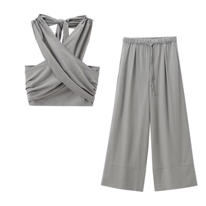 Women's 2-piece grey linen set with halter neck crop top and wide-leg trousers