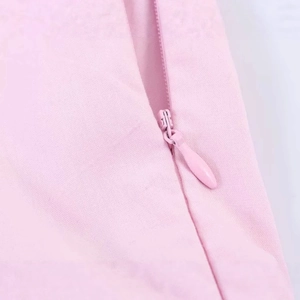 Pink poplin halter mini dress featuring a discreet side invisible zipper closure