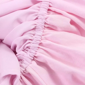Pink poplin halter neck dress with detailed elastic shirring texture and soft cotton fabric