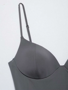 Detail of dark grey seamless camisole featuring molded cups and adjustable spaghetti straps
