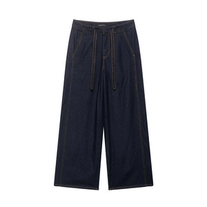 Flat lay of dark blue denim wide-leg pants with high waist and yellow contrast stitching