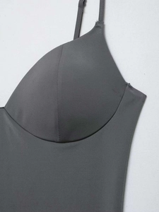 Detail of dark grey seamless bodysuit featuring built-in padded cups and thin straps