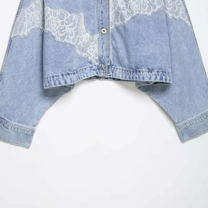 Short denim jacket with white floral lace patchwork and metal buttons in light blue