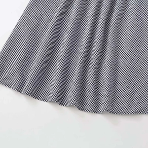 Classic black and white gingham skirt with elastic waist showing soft fabric texture