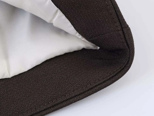 Close-up of brown textured fabric and white lining showing the premium stitching detail