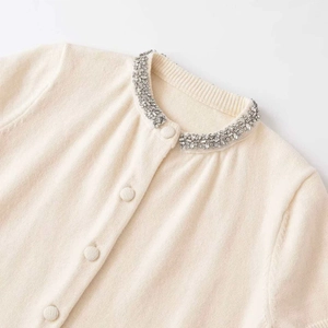Chic beige knit cardigan with crystal rhinestones on round neckline and fabric buttons
