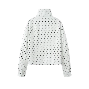 Rear view of white polka dot jacket featuring a stand collar and lightweight fabric