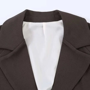 Classic brown blazer for women featuring a minimalist notch lapel and premium woven texture