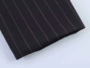 Detailed macro view of pinstripe fabric texture for striped dress in dark blue and brown
