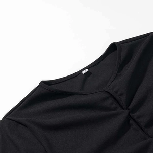 Elegant black ribbed knit top with a subtle round neckline cutout and vertical texture