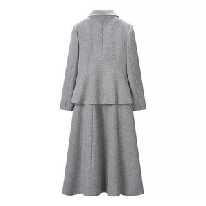 Back view of a grey slim-fit blazer and A-line long skirt set with structured seams