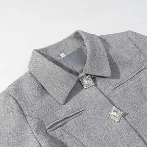 Elegant grey tweed blazer for women featuring rhinestone buttons and a tailored lapel