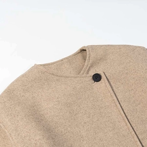 Chic camel wool blend short coat with a minimalist round neck and black button detail