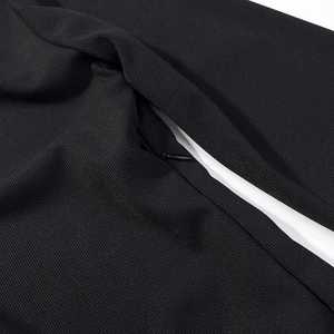 Close-up of the high-quality invisible zipper on the black contrast lace dress