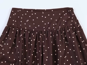 Detail view of high waist polka dot wide leg trousers with shirred waist and side zipper
