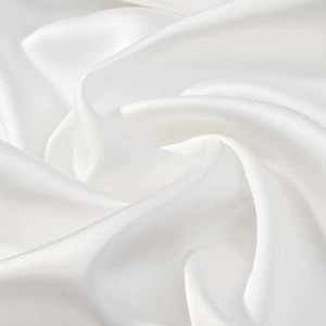 Detail of elegant white satin fabric showing smooth texture and pearlescent luster