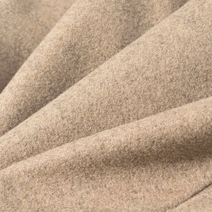 Macro shot of high-quality camel wool fabric showing soft texture and fine fibers