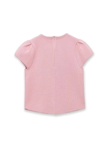 Detail view of pink puff sleeve knit top featuring a textured ribbed fabric and back zipper