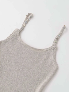Detailed view of grey knit camisole featuring colorful buttons on slim shoulder straps