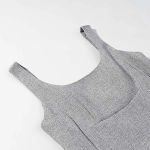 Detail of square neckline and wide shoulder straps on a grey linen-textured tailored top