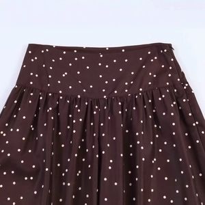 Retro high-waisted brown polka dot wide-leg trousers with elegant pleats and side zipper
